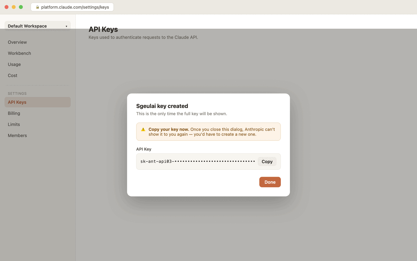 The key-created dialog: a warning that this is the only time the full key will be shown, and a monospace field holding the key (starting sk-ant-api03-) next to a Copy button.